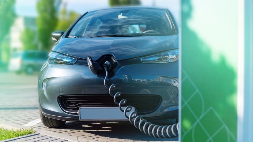 plugged-charger-into-electric-car-charge-station_1268-17715.jpg