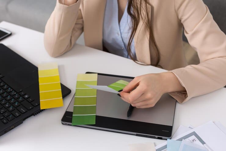 young-designer-girl-sitting-table-draws-tablet-makes-business-calculations_81340-11366.jpg